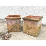 A pair of terracotta garden planters, with lozenge decoration (37cm x 36cm x 36cm)