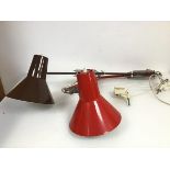 A pair of anglepoise style wall lights with adjustable arms and wall mounts, one stamped Made in