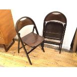 A pair of 1970s folding chairs, the domed top rail over an imitation lizardskin back splat with