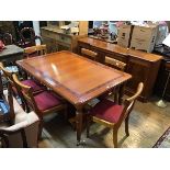 A Charles Barr yew wood dining room suite comprising dining table with mahogany banding, on turned