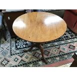 A George III mahogany tilt top table, on tripod base with slipper feet (69cm x d.78cm)