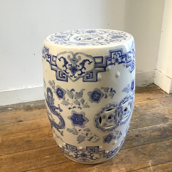 A modern Chinese style porcelain verandah stool of drum form, with pierced panel sides and top,