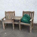 Alexander Rose, garden chairs, united by a two tier table, creating a slight curvature, with holes