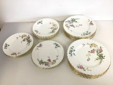 A 1930s set of Minton plates, in Dainty Sprays pattern (d.23cm) (14) and ten side plates of the same