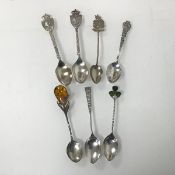 A collection of novelty spoons including Birmingham silver Aberdeen and Kilkenny, another with