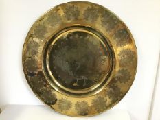 A large Indian brass dish with a central engraved Peacock surrounded by multiple peacock border (d.