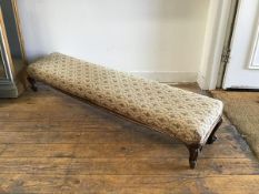 A Victorian walnut slope front fender stool, the rectangular top upholstered in floral tapestry,