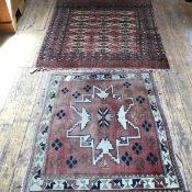 A Bokhara rug, the centre panel with three rows of seven octagons enclosed within a stylised leaf