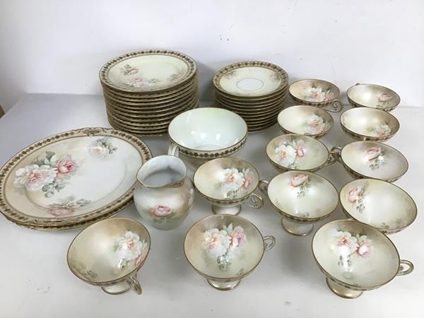 A 1920s German tea service with rose and gilt decoration, stamped R.S. Germany to base, includes