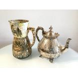 An Epns tapered engraved and chased teapot with crenallated top (h.21cm) and a Doulton Burslem