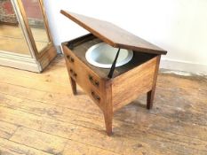A 19thc commode, the rectangular hinged top enclosing a ceramic chamber pot with two dummy