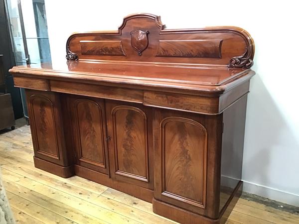 A Victorian mahogany ledgeback sideboard, the rectangular top with moulded edge above an arrangement