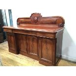 A Victorian mahogany ledgeback sideboard, the rectangular top with moulded edge above an arrangement