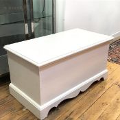 A white painted pine blanket/toy box, the rectangular hinged top enclosing a plain interior,