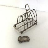 A Gothic style Victorian London silver toastrack (a/f) (12cm x 13cm x 7cm) and a silver decanter