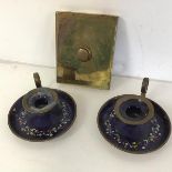 An Edwardian brass doorbell (13cm x 10cm) and a pair of enamel on copper chamber candlesticks (3)