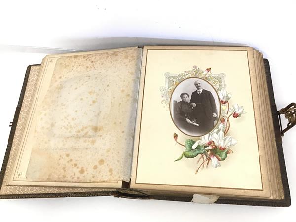 A late Victorian musical photograph album complete with key and an assortment of photographs (8cm