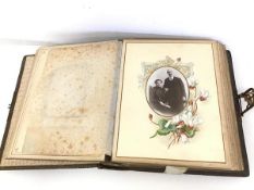 A late Victorian musical photograph album complete with key and an assortment of photographs (8cm
