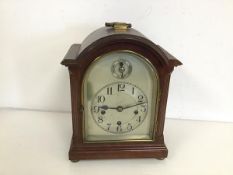 A 1930s/40s mantel clock, with domed top above a metal dial, on bun feet (a/f) (27cm x 15cm x 22cm)