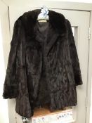 An Arnold Seftor Ltd., Edinburgh mink coat (40cm shoulders, 72cm length)