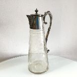 An Edwardian claret jug with Epns mount to hinged top, with scroll handle to side, with engraved