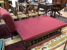 An unusual Victorian stained beech fold out chaise longue daybed with scroll button ends and fold