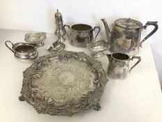 An Epns footed tray with fruit and leaf decoration, a teapot, milk jug and sugar bowl, with