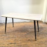 A mid century formica topped rectangular coffee table with wood effect top, with moulded edge on