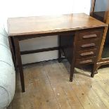 A 1920s/30s oak single pedestal typist's desk, the rectangular top with moulded edge and drop flap