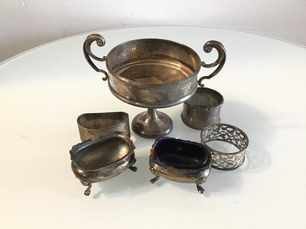 An Edwardian London silver miniature two handled trophy, a Chester silver salt and a Birmingham