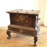 A 1920s Eastern hardwood brass mounted box, the hinged top enclosing a plain interior with brass