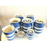 A set of five original Cornish Kitchen unmarked storage jars, one lid a/f, with green back stamp and