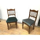 A pair of late Victorian side chairs, with turned spindle backs above green upholstered seats, on