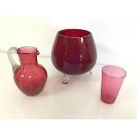 A Swedish red glass footed vase or bowl with outswept feet, with Swedish Art Glass stamp (17cm x d.