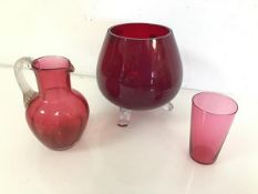 A Swedish red glass footed vase or bowl with outswept feet, with Swedish Art Glass stamp (17cm x d.