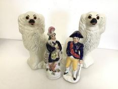 A pair of 19thc Staffordshire chimney spaniels (26cm x 16cm x 8cm) and a Staffordshire figure of a