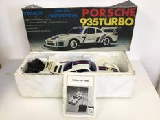 A Tandy Porsche 935 Turbo radio controlled car (l.40cm), with original box