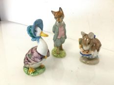 Three Beatrix Potter figures by F. Warne & Co. Ltd., including Jemima Puddleduck, Foxy Whiskered