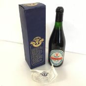 A 1985 bottle of Tennents Centenary Lager with original box (h.30cm) (a/f)