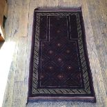 A Persian prayer rug, the shaped centre panel with diamond and flowerhead interior, enclosed