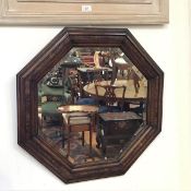 A 1920s oak octagonal moulded frame wall mirror with bevelled glass plate (d.80cm)