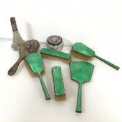 A 1930s Birmingham silver guilloche dressing table set including mirror (28cm), two hairbrushes