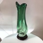 A 1960s Austrian green to clear spiral Art Glass vase raised on hardwood stand, unsigned (h.50cm x