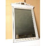 A modern wall mirror with bevelled glass plate within moulded and white painted frame (83cm x 52cm)
