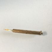 An Edwardian 9ct gold engine turned decorated toothpick (l.5cm) (6.35g)