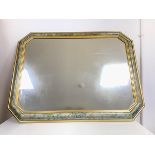 A modern wall mirror with gilt and foliate painted moulded frame (73cm x 93cm)