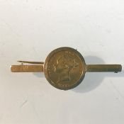 A Victorian half sovereign, 1869 mounted in 9ct gold mount, with clip fastening (730g)