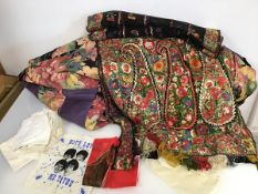 A collection of textiles including an Indian embroidered shawl or wrap with paisley embroidered