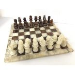 A brown and white agate chess set (board: 38cm x 38cm)