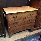 An Arts & Crafts oak chest, the rectangular top with moulded edge above three graduated long